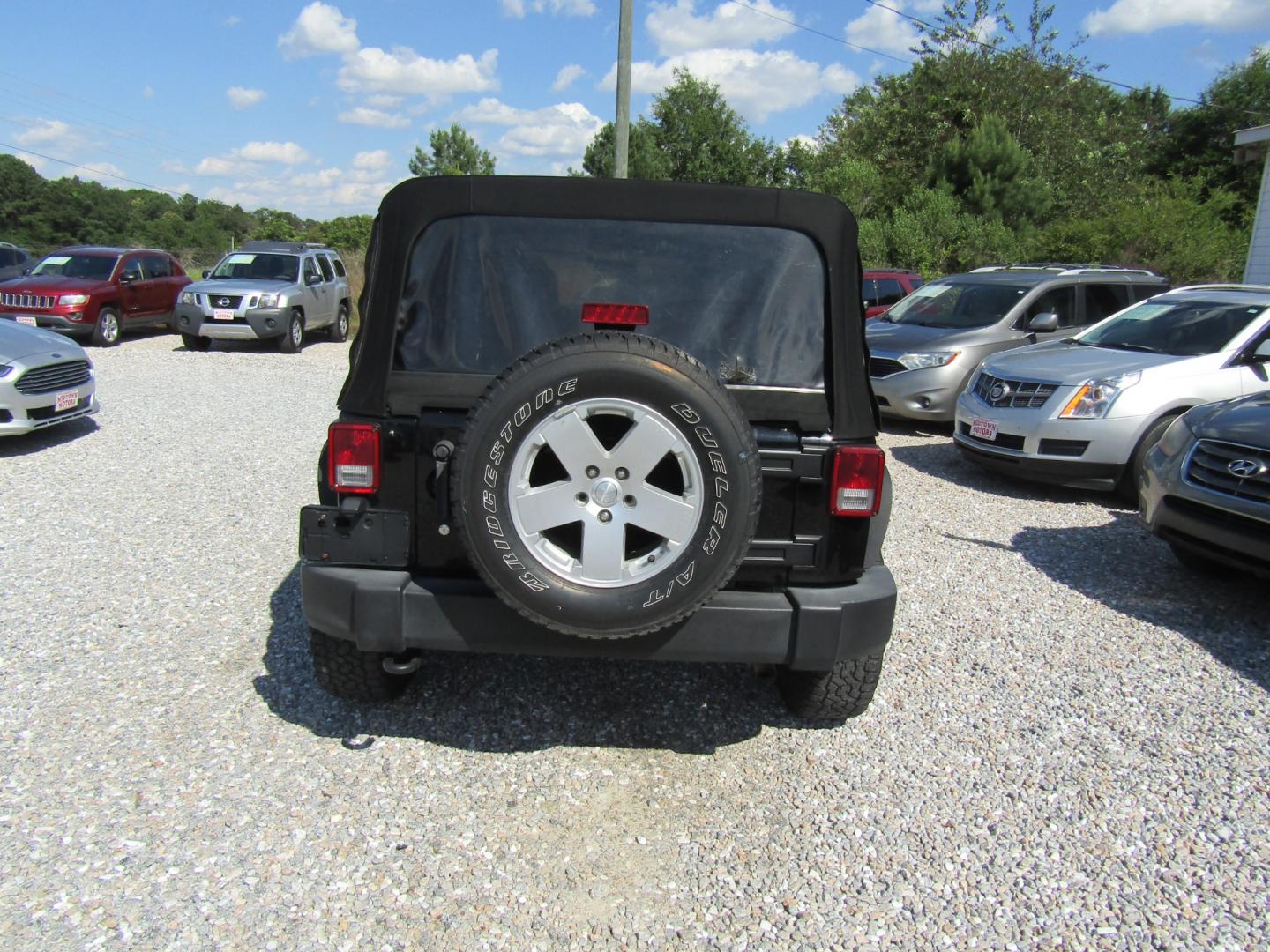 2015 Black /Tan Jeep Wrangler (1C4BJWDG8FL) with an V6 engine, Automatic transmission, located at 15016 S Hwy 231, Midland City, AL, 36350, (334) 983-3001, 31.306210, -85.495277 - Photo#6